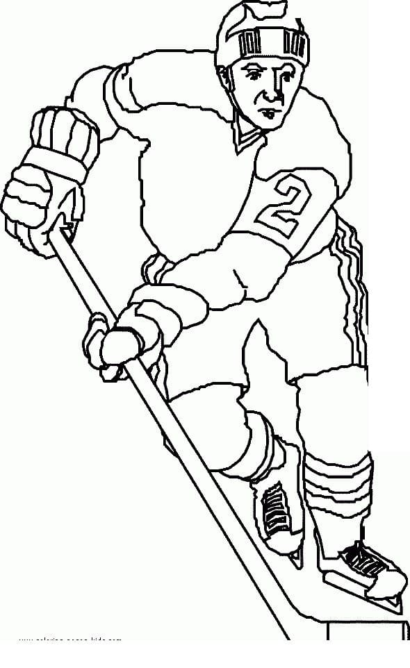 Man With Field Hockey Sticks And Ball